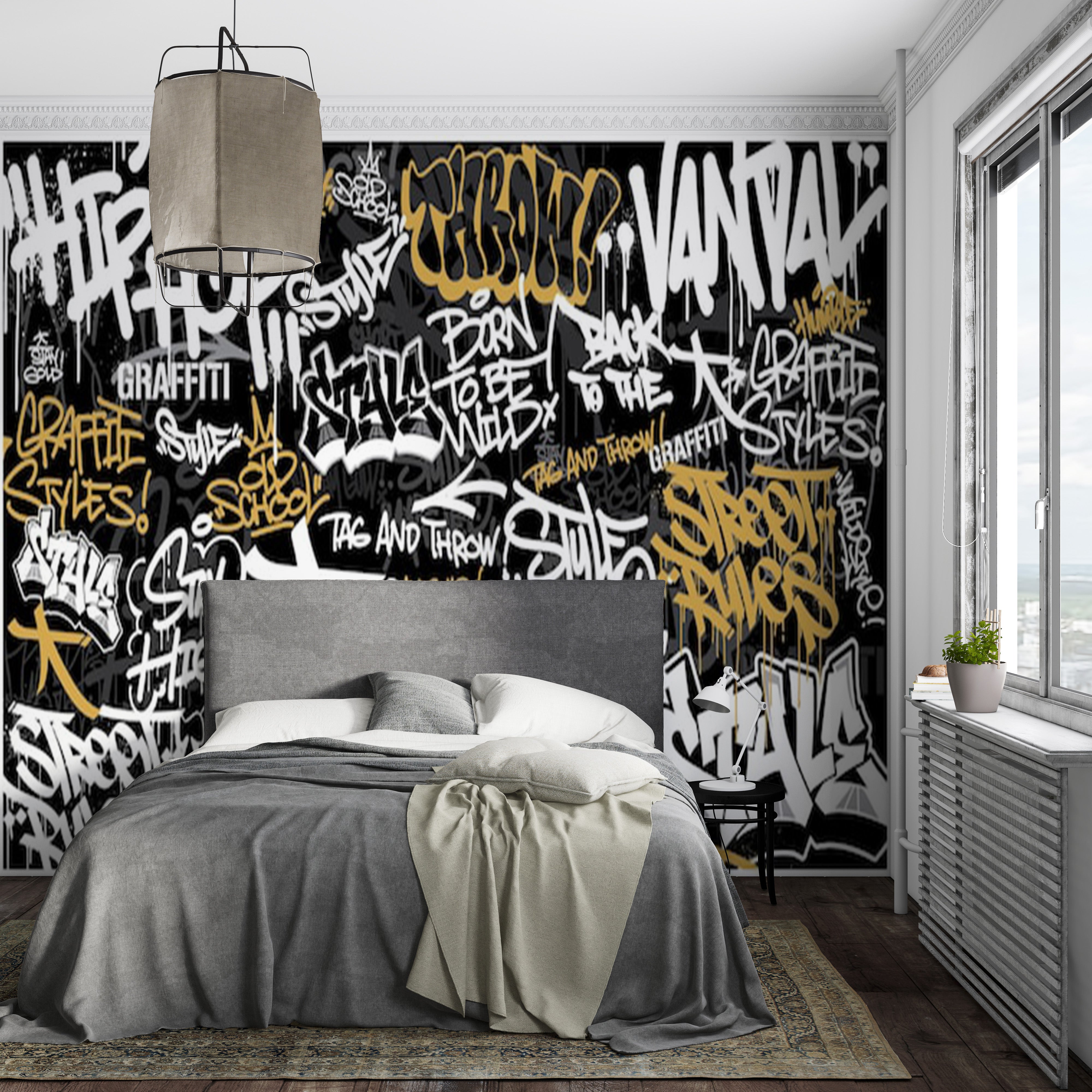 Papier peint street art urbain avec mur graffiti noir, blanc et or dans chambre moderne