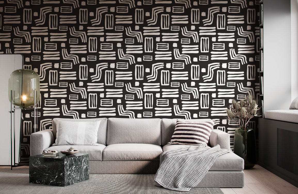 Canapé sectionnel gris moderne avec coussins et couverture, idéal pour un mural abstrait