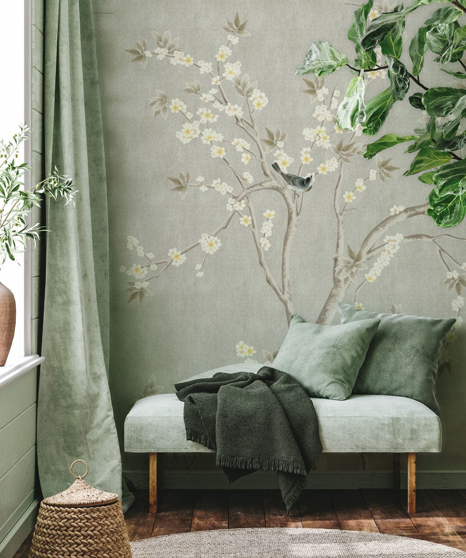 Banquette rembourrée vert clair avec coussins et plaid, parfait pour un papier peint mural Arôme de Branche