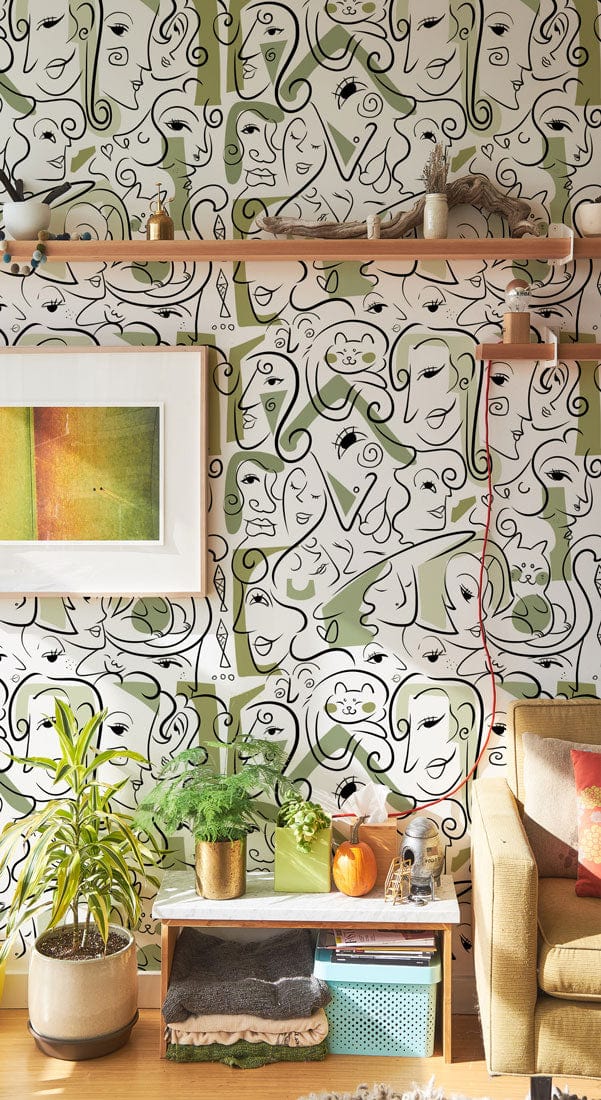 Peint mural aux faces vertes avec dessins de chats et visages abstraits