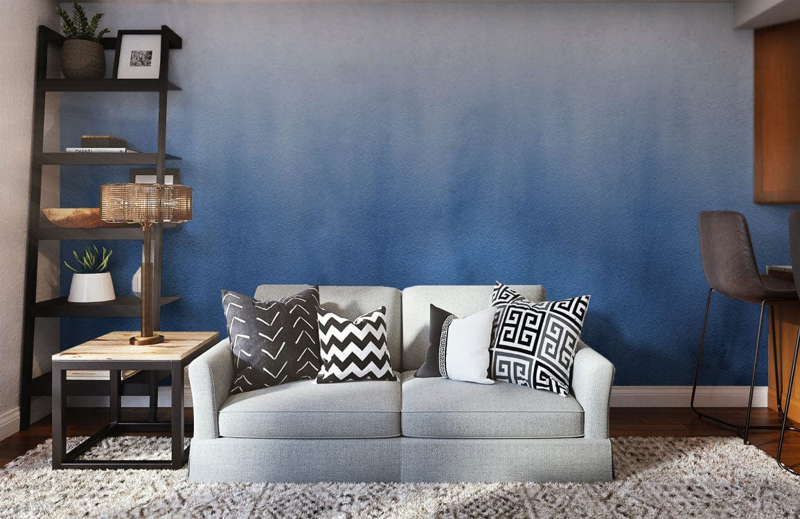 Canapé deux places gris clair avec coussins décoratifs, idéal pour peinture murale mural bleu brumeux