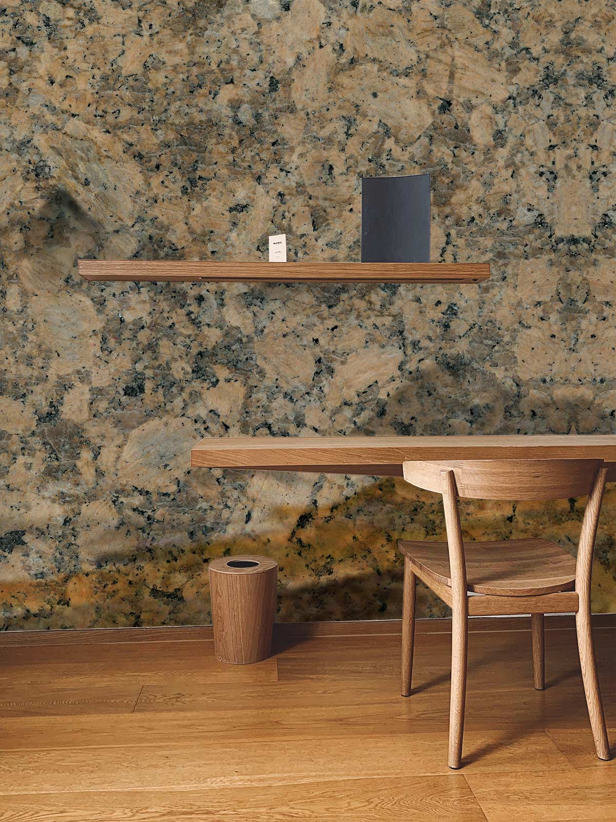 Textured wall paneling in shades of brown, beige, and dark grey for papier peint mural effet pierre brun blocs