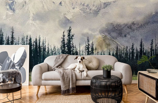 Canapé gris clair avec jambes en bois, couverture et coussin, mural représentant forêt et montagne enneigée
