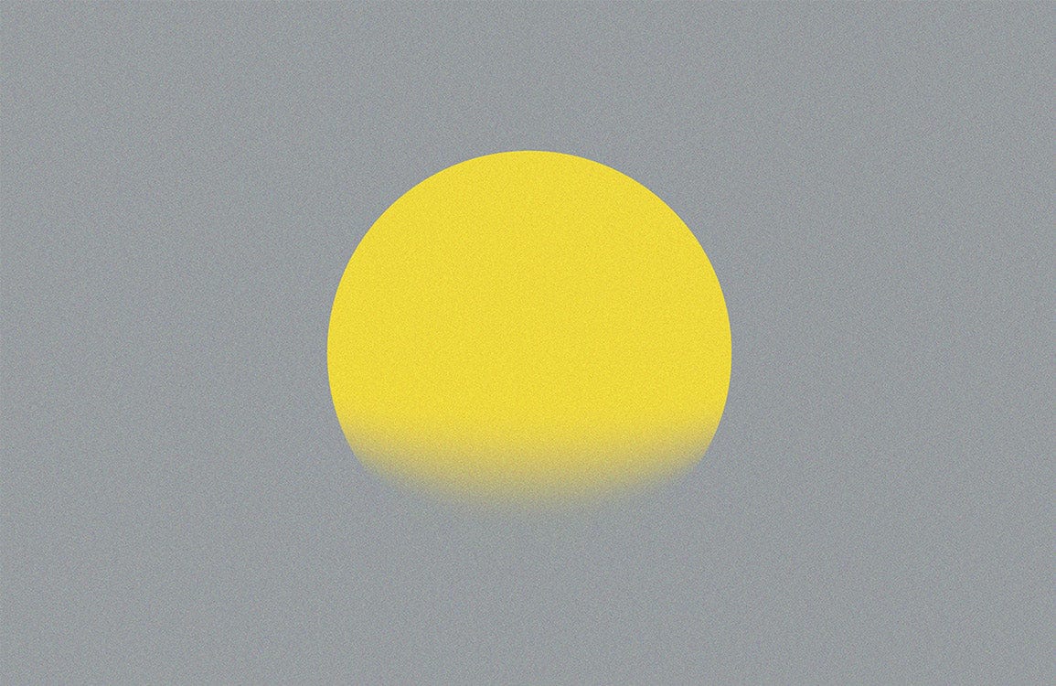 Alt texte : Sphere jaune vibrante partiellement immergée dans une substance grise pour peinture murale Halo