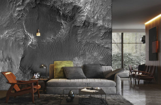 Sofa moderne avec coussins doux dans un salon avec papier peint mural motif roche lunaire