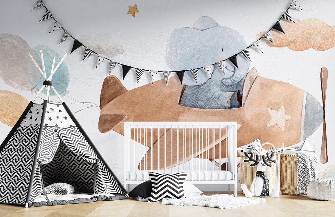 Nursery avec un lit blanc et une tente teepee noir et blanc, mural pilote d’Éléphant