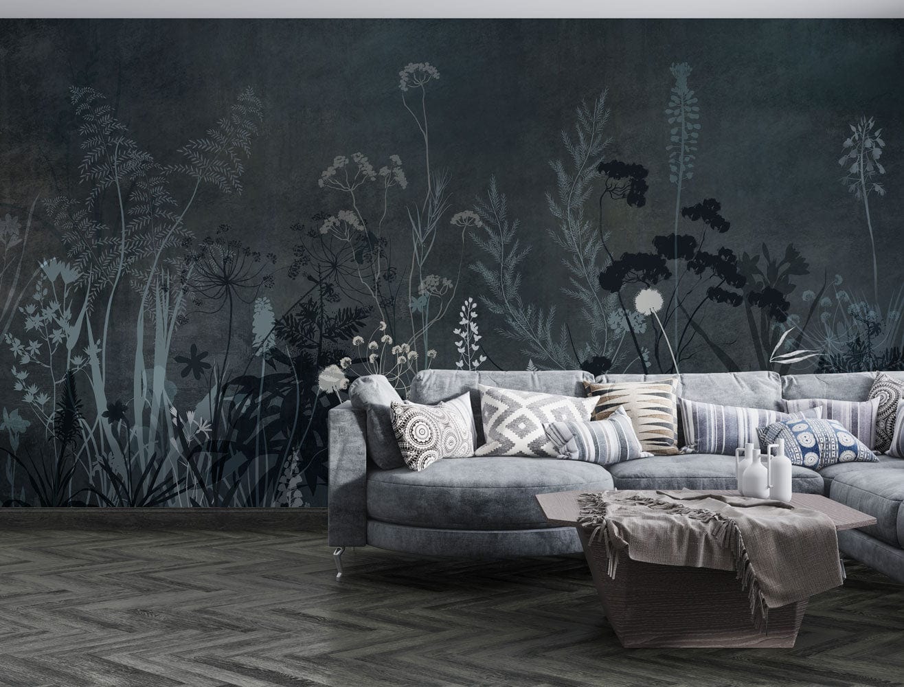Papier peint mural buissons sombres avec canapé d’angle gris foncé et coussins déco