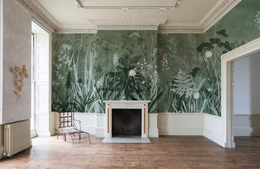 Papier peint mural silhouette de buissons verts dans une pièce avec cheminée et grande fenêtre