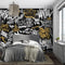 Papier peint street art urbain avec mur graffiti noir, blanc et or dans chambre moderne